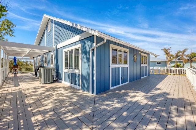 wooden terrace featuring central AC unit