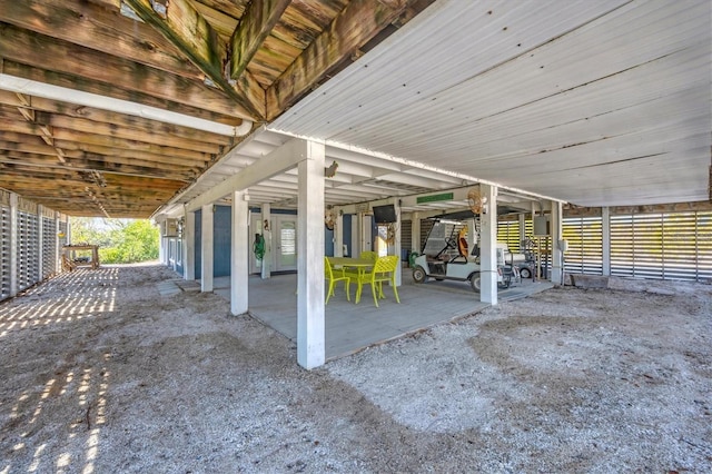 view of patio featuring an outbuilding and an exterior structure