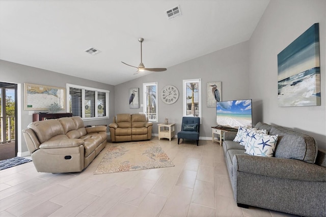 living room with lofted ceiling, visible vents, ceiling fan, and baseboards