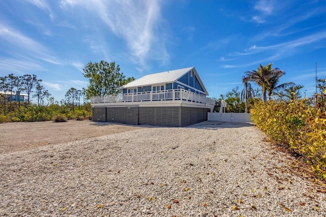 exterior space featuring a deck and fence