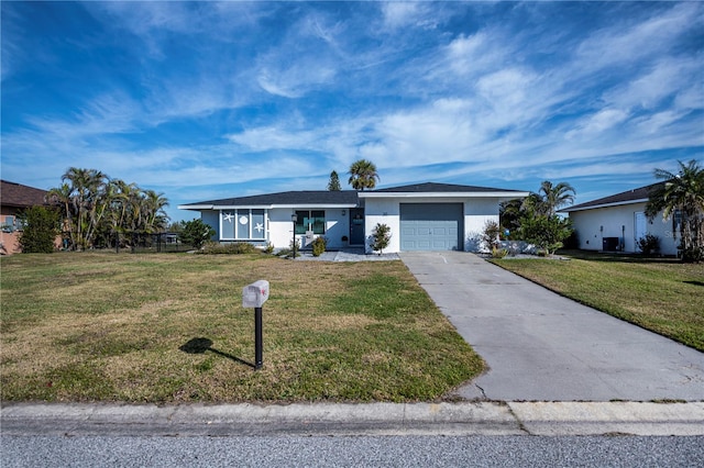 ranch-style home featuring a garage and a front lawn