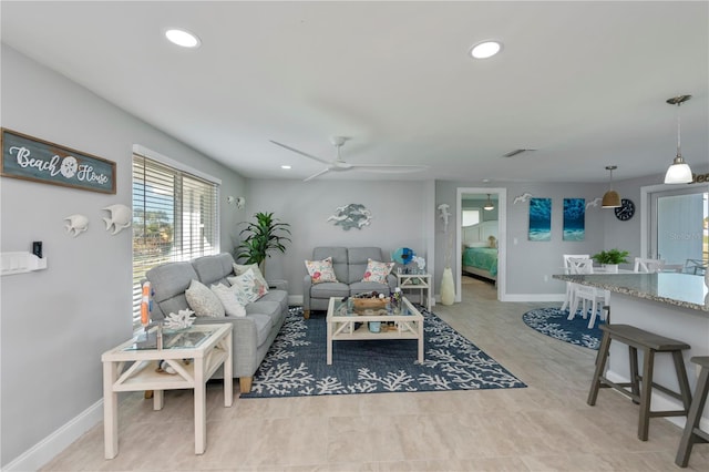 living room featuring ceiling fan