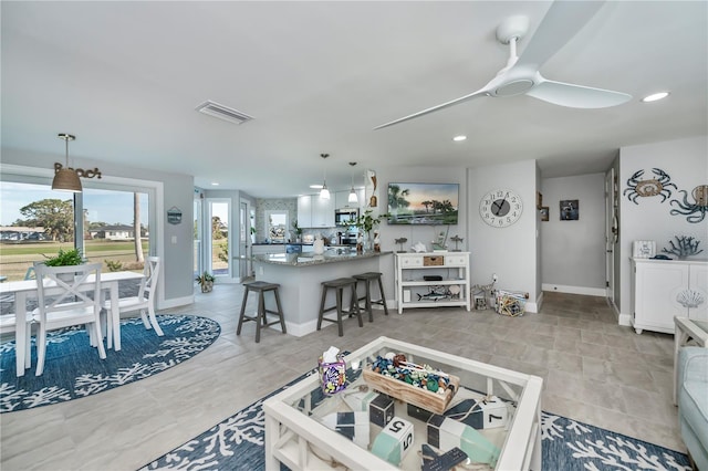 living room with ceiling fan