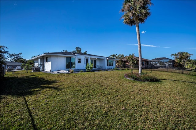 ranch-style home featuring a front yard