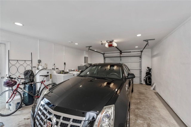 garage featuring a garage door opener and washing machine and dryer