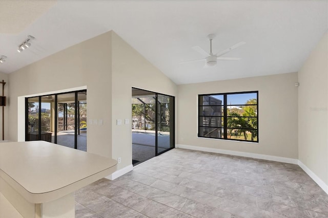 interior space with a lanai and ceiling fan