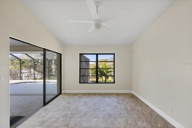 spare room with lofted ceiling and ceiling fan