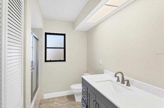 full bathroom with bath / shower combo with glass door, vanity, and toilet