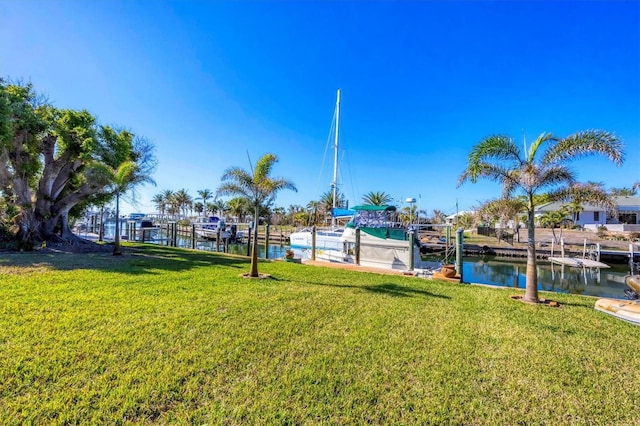 exterior space with a lawn and a water view