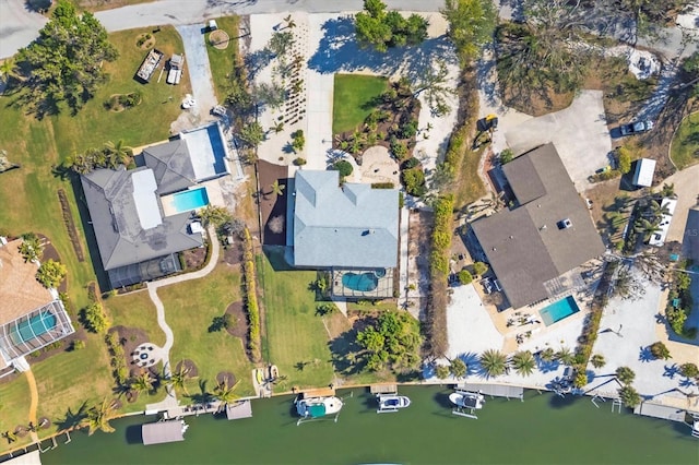 birds eye view of property featuring a water view