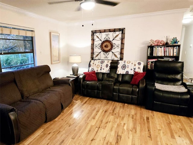 living room with ornamental molding, hardwood / wood-style floors, and ceiling fan