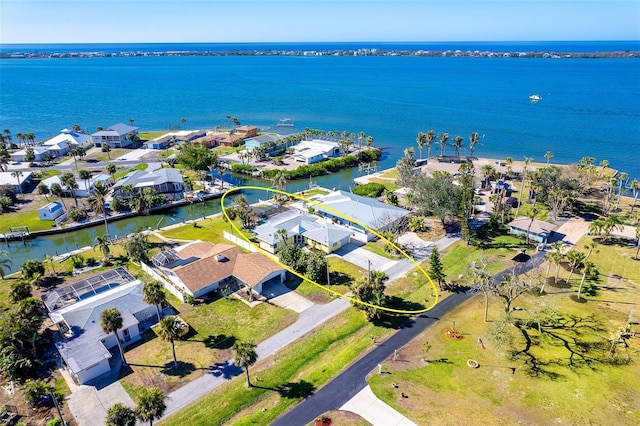 birds eye view of property with a water view