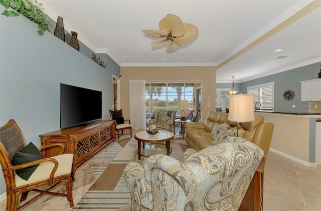 living room with ornamental molding and light tile patterned flooring