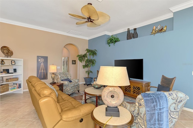 living room featuring light tile patterned flooring, ceiling fan, and crown molding