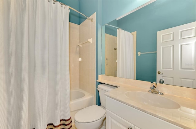 full bathroom featuring vanity, shower / tub combo, and toilet