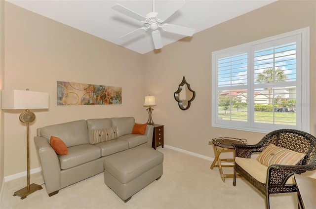 carpeted living room featuring ceiling fan