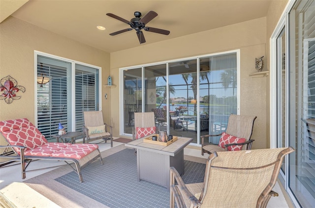 view of patio / terrace with ceiling fan and outdoor lounge area