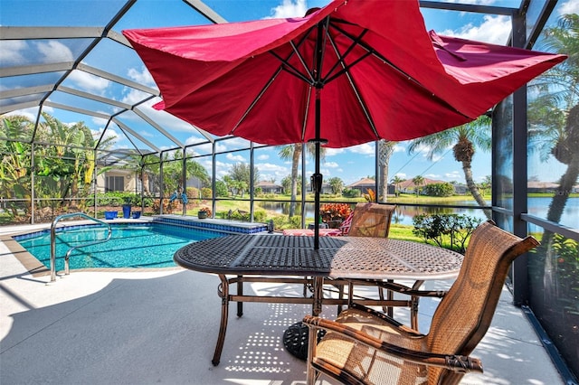 view of swimming pool with a water view, a lanai, and a patio area