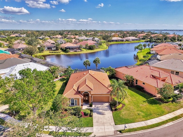 birds eye view of property with a water view