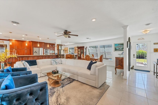 tiled living room featuring ceiling fan