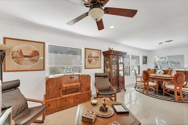 tiled living room featuring crown molding and ceiling fan