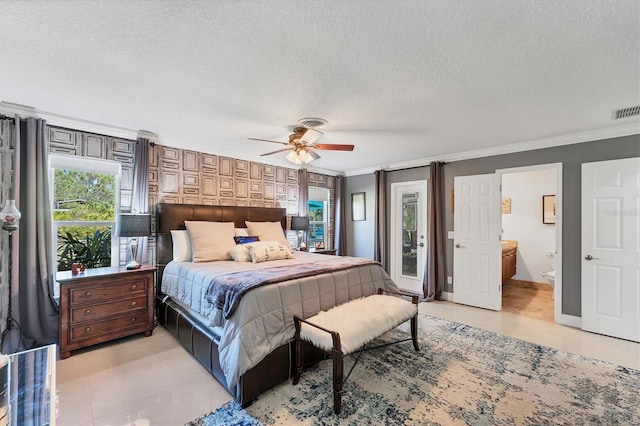 bedroom featuring crown molding and a textured ceiling