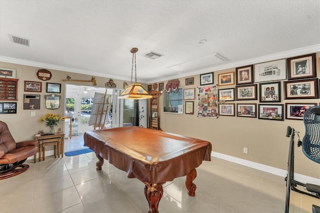 game room with billiards, ornamental molding, light tile patterned floors, a textured ceiling, and french doors