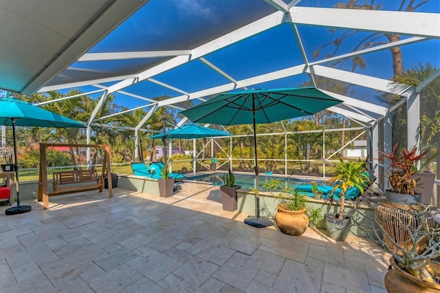 view of patio with glass enclosure