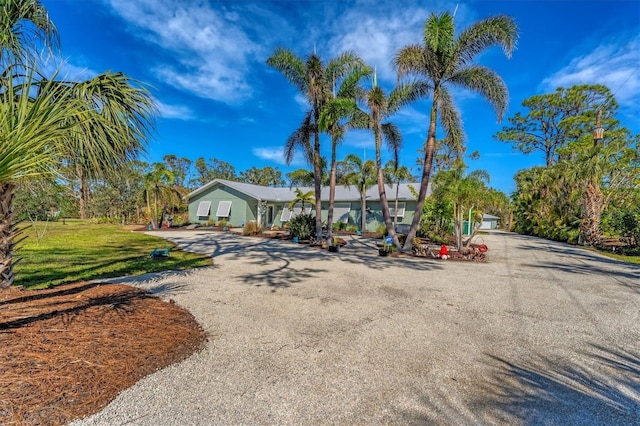 ranch-style home featuring a front yard