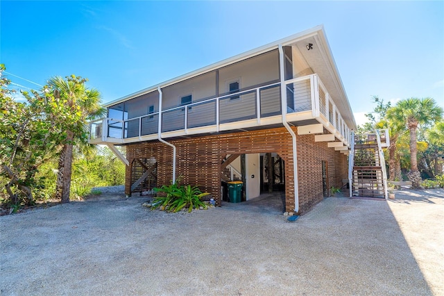 rear view of property featuring a carport