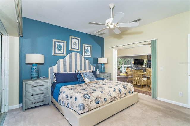 bedroom with ceiling fan and light colored carpet