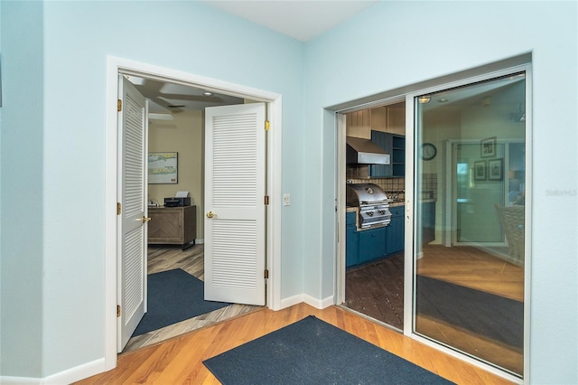 hallway featuring hardwood / wood-style flooring