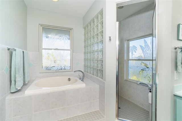 bathroom with shower with separate bathtub