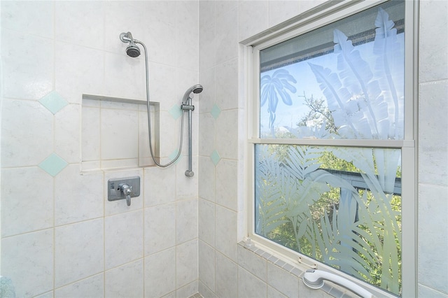 bathroom with tiled shower