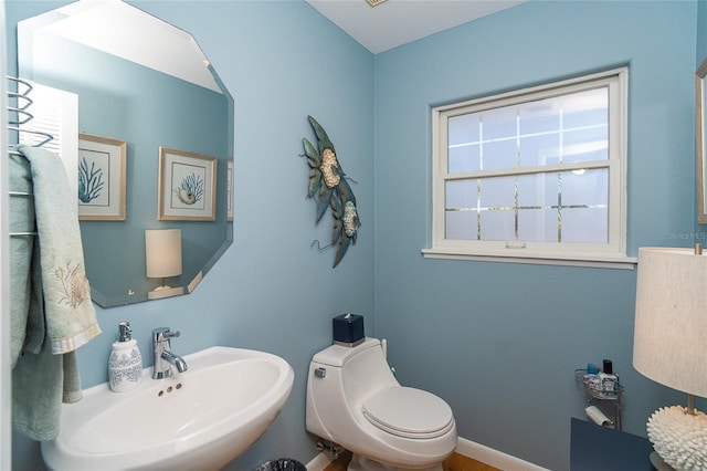 bathroom with sink and toilet