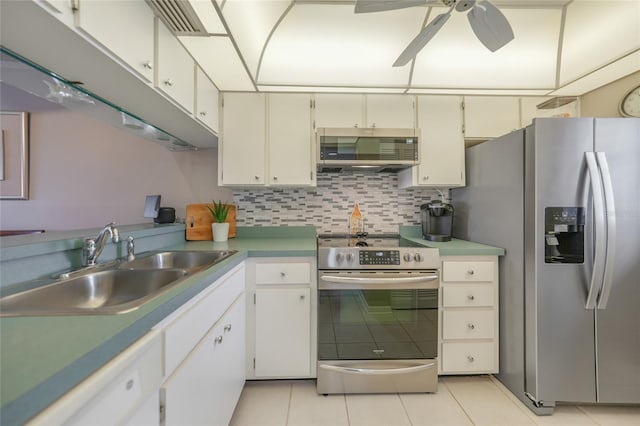 kitchen with stainless steel appliances, white cabinetry, sink, and decorative backsplash