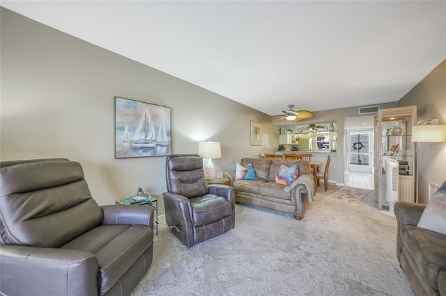 living room with carpet and ceiling fan