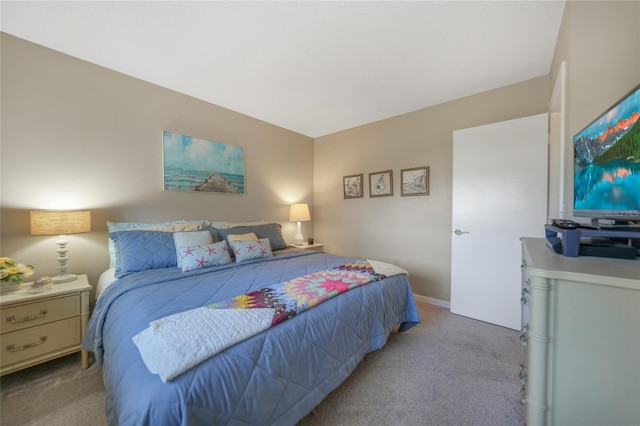 bedroom featuring light carpet