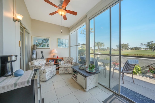 sunroom featuring ceiling fan