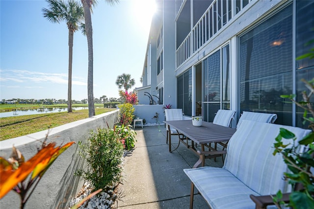 view of patio / terrace with a water view