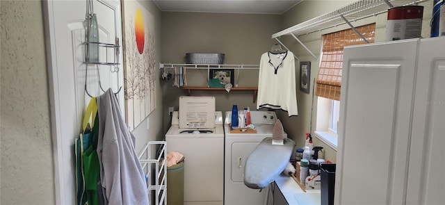 laundry room featuring washing machine and clothes dryer