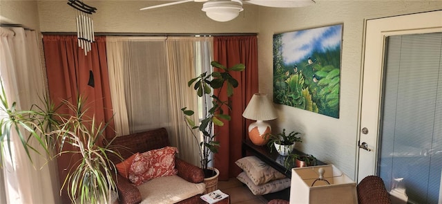 living area featuring ceiling fan