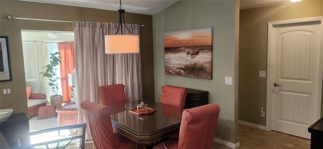 dining room featuring tile patterned flooring