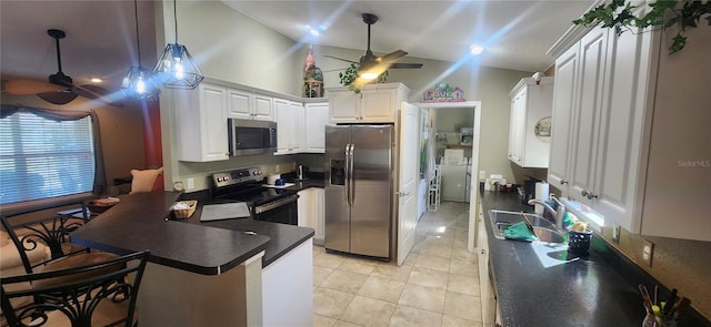 kitchen featuring appliances with stainless steel finishes, sink, white cabinetry, ceiling fan, and kitchen peninsula