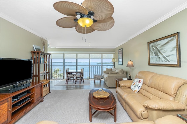 living room with ornamental molding and ceiling fan