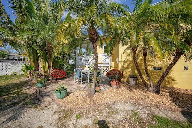 view of yard with cooling unit and a patio