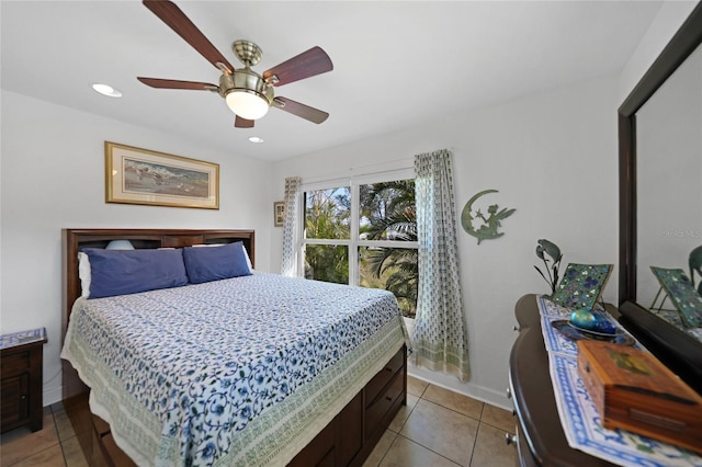 bedroom featuring light tile patterned floors and ceiling fan