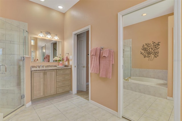 bathroom featuring vanity, tile patterned floors, and independent shower and bath