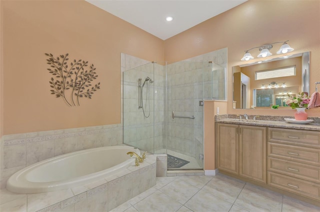 bathroom featuring independent shower and bath, vanity, and tile patterned floors