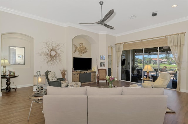 living room featuring ornamental molding, dark hardwood / wood-style floors, and ceiling fan